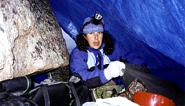 Waiting out the weather under our tarp at camp.