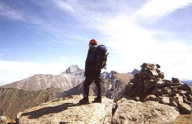 Lisa looking into the Sky Pond Cirque from the top of Taylor. Long's is clearly visible in the background.